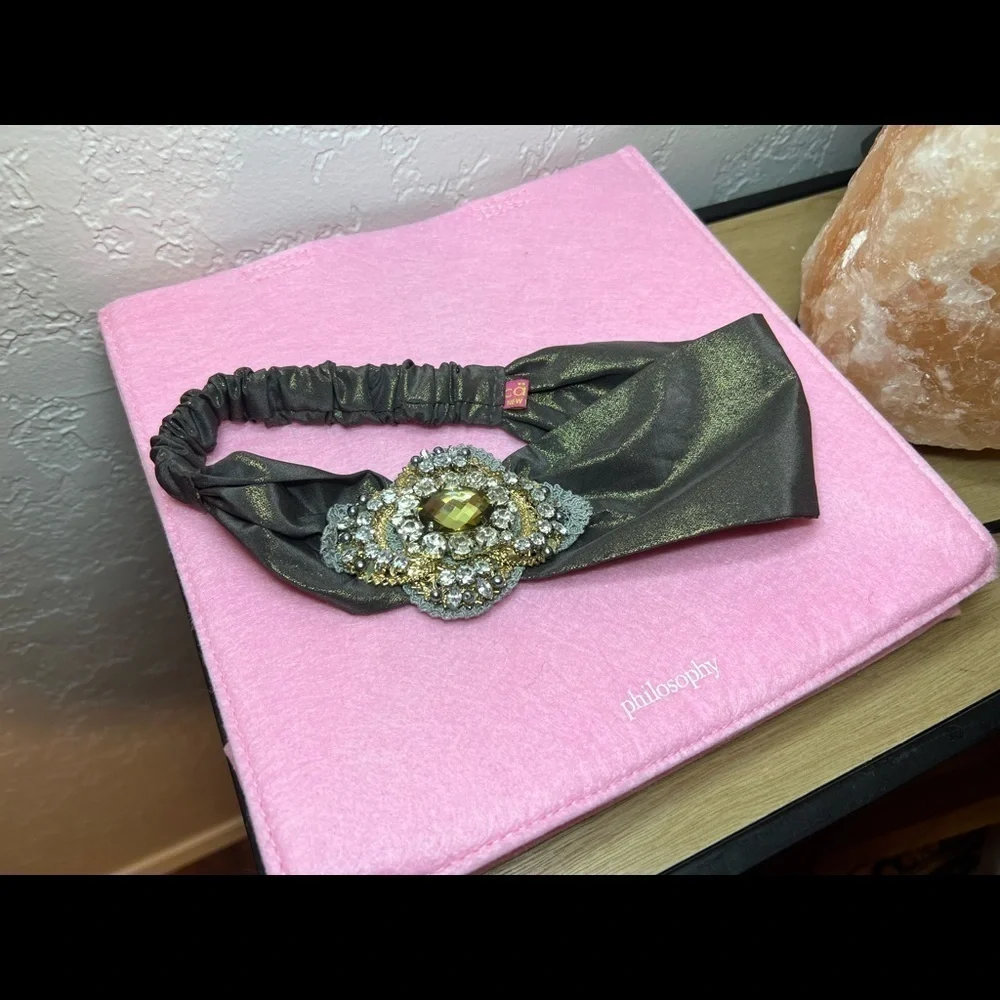 Headband, sparkling fabric and stunning brooch